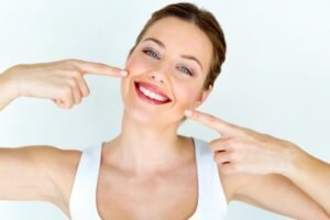 Patient smiling after painless dentistry treatment at Archak Dental Clinic Bengaluru